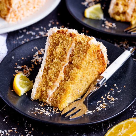 Vegan Lemon Coconut Cake on black plate