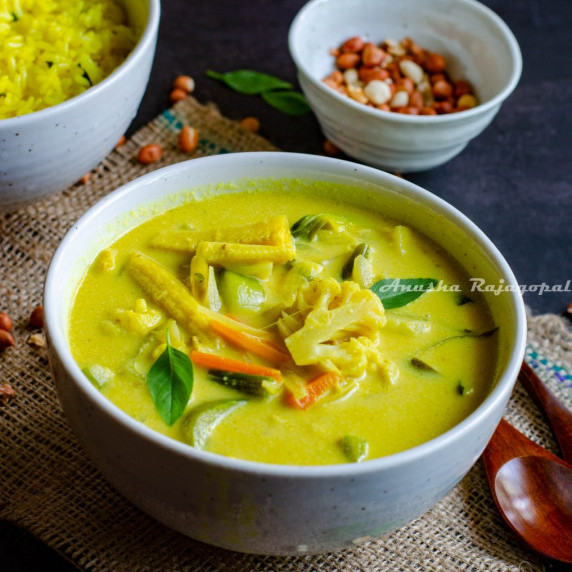 Vegan yellow thai curry served in a deep white bowl. 